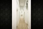 long-hall-white-walls-light-floorboards