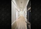 victorian-home-converted-to-office-modern-lighting-white-walls-long-hallway