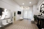 victorian-home-converted-into-non-surgical-cosmetic-clinic-waiting-room-picture-of-face-white-walls-and-chairs