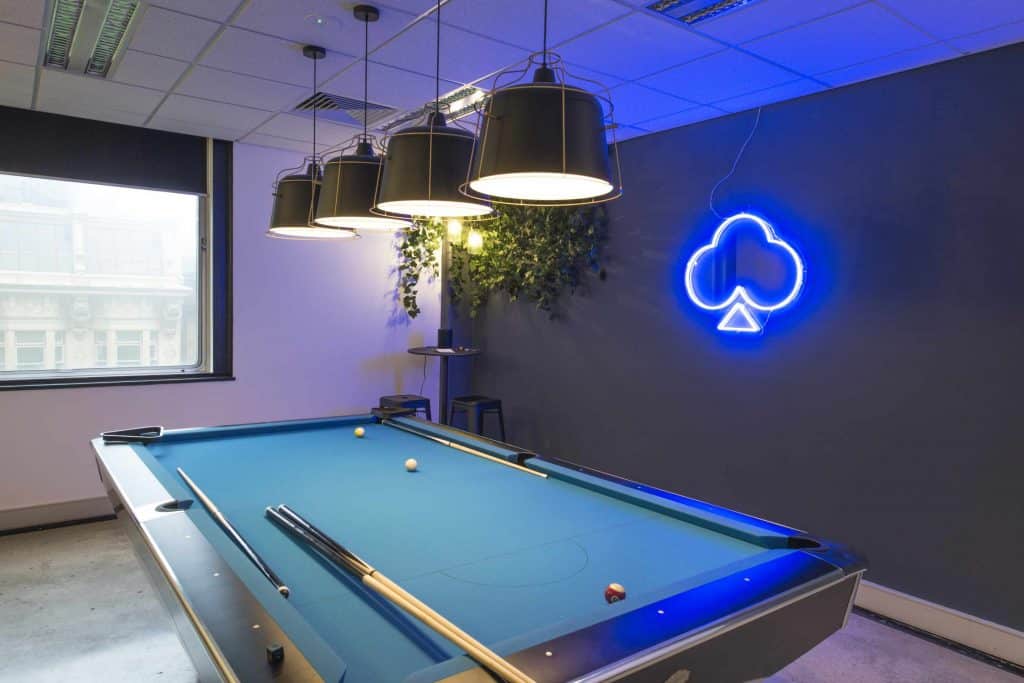 Office workspace design for staff to relax with pool table.